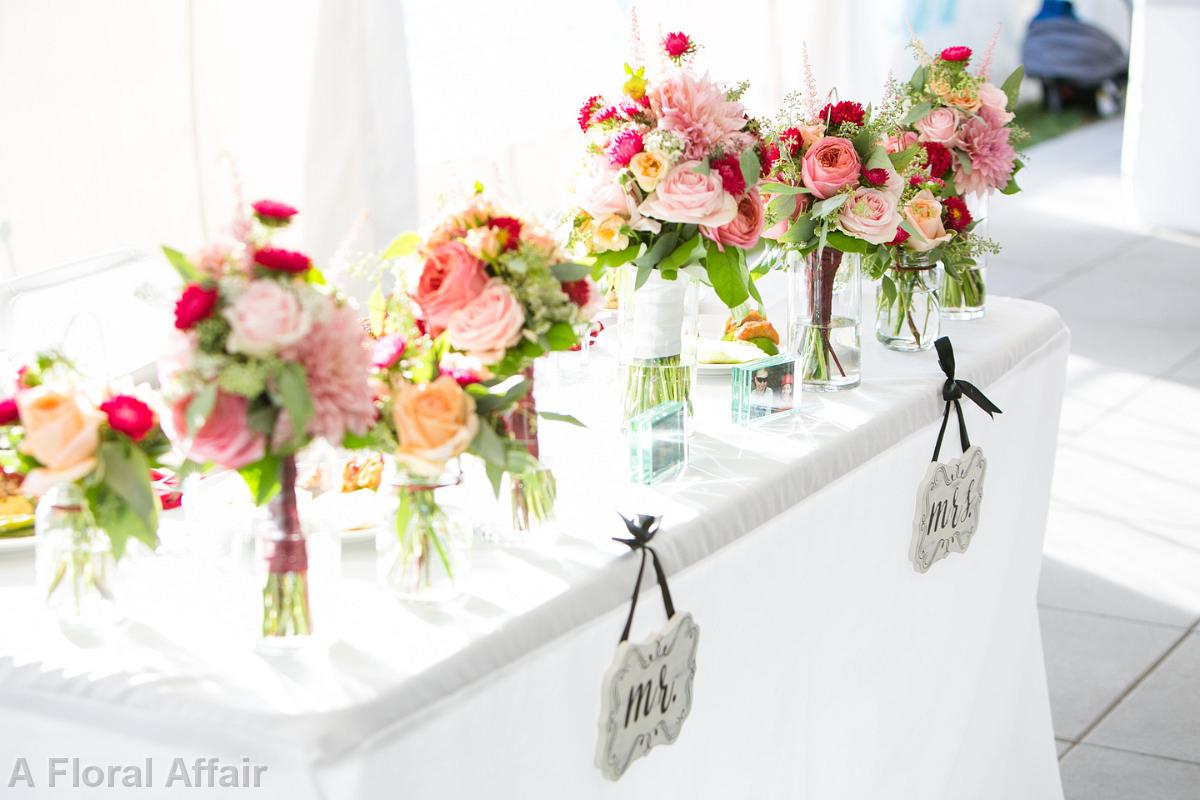 BB1266-Bridal party flowers on head table. Rock Creek Country Club