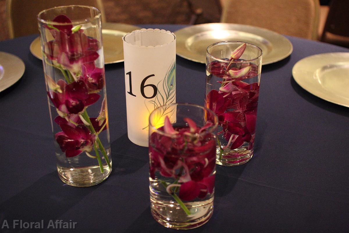 RF0470-Peacock Feather and Orchids Under Water Centerpiece