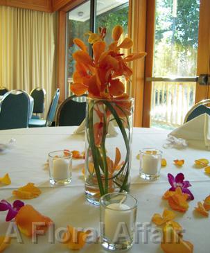 RF0936-Elegant, Orange and Plum Centerpiece with Candle Accent