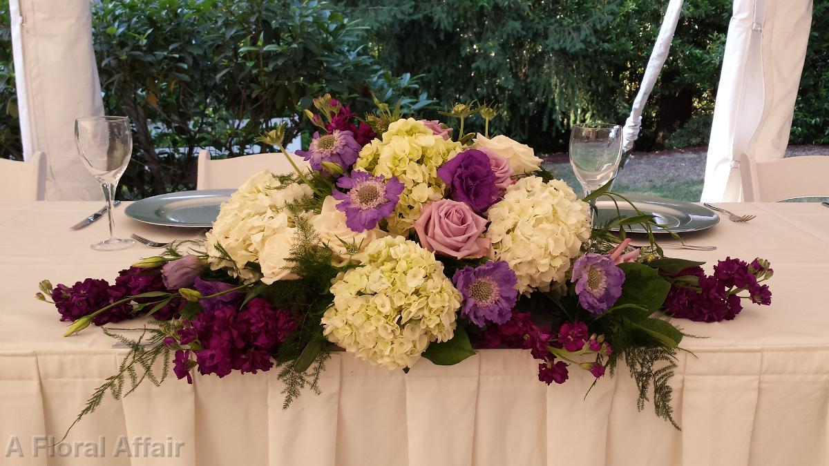 RF1152-Low Purple, Freesia and WHiteHead Table Arrangement